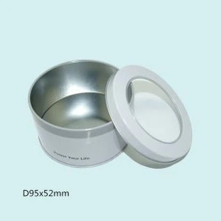 Scatola di latta rotonda con finestra